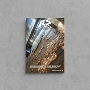 Portada de L'Art de Viure Andorra núm. 126 amb un revestiment mural de peces de fusta i pedra il·luminat lateralment en un interior contemporani, amb el logotip de la revista.