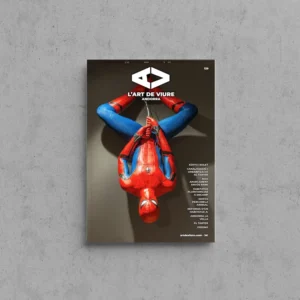 Portada de L'Art de Viure Andorra núm. 129 amb una figura de superheroi vermella i blava suspesa cap per avall d'un fil sobre un fons fosc, amb el logotip de la revista.
