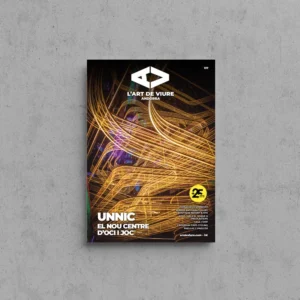 Portada de L'Art de Viure Andorra núm. 137 amb un joc de traços de llum daurats en moviment sobre un fons fosc i el segell dels 25 anys, sota el títol Unnic · El nou centre d'oci i joc.