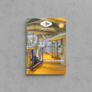 Portada de L'Art de Viure Andorra núm. 138 amb l'interior de la central FEDA Ecoterm, ple de canonades i conductes metàl·lics sobre un terra groc, i el segell dels 25 anys, sota el títol FEDA Ecoterm · Canvi de model energètic.